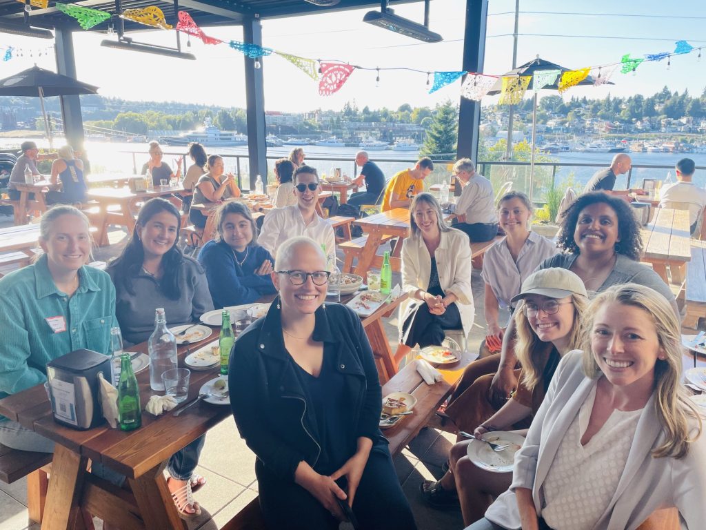 2023 Washington Sea Grant Fellows' orientation eating on a waterfront.