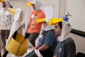 Judges of Orca Bowl 2025, wearing seagull hats.