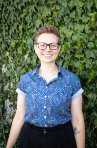 Kaitlyn Kowaleski against a green plant background