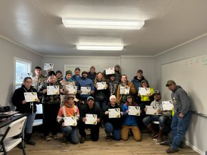Skills and Drills students show off their certificates of completion.