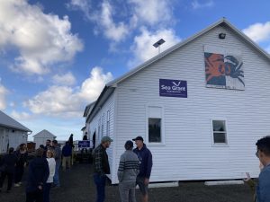 Guests stand outside the WSG South Bend office at Bendiksen Landing.