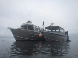 two boats on the river in foggy weather