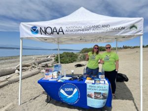 WSG team members Maile Sullivan (left) and Elise Adams (right) hosting a WSG–NOAA booth.
