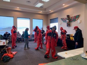 Makah Tribal fishermen don safety suits