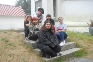 Ocosta High School’s Director of After School Programs Andrea Mirante and students who worked on the videos at the Grays Harbor Lighthouse, a tsunami assembly area.