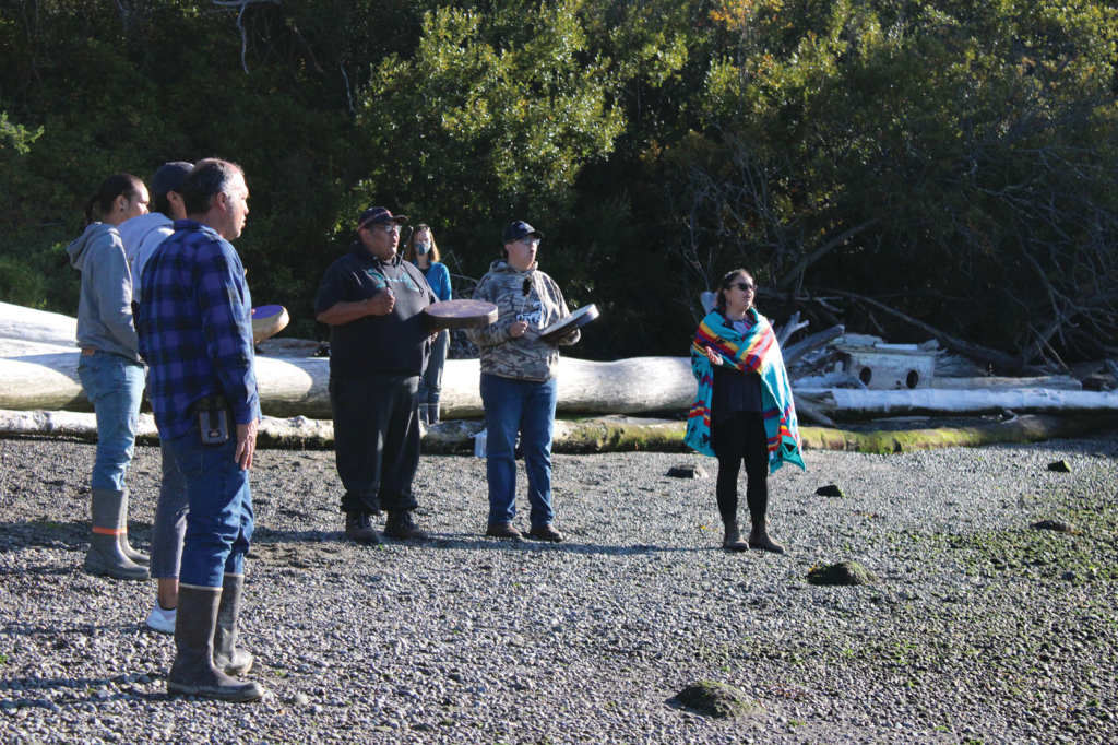 Swinomish Indian Tribal Community bless the site on Kiket Island where they plan to build a clam garden.