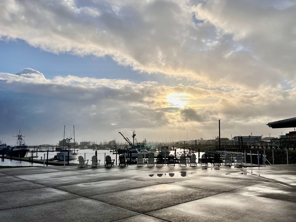 Sun breaks through clouds over Westport Marina