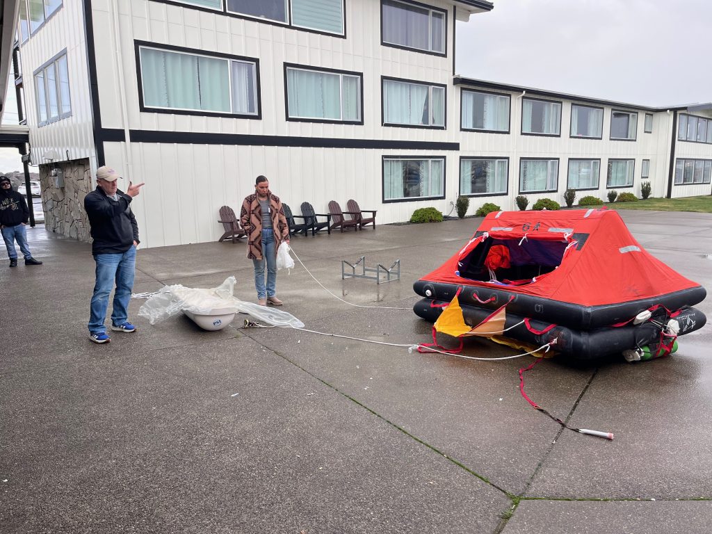 Robert Maw leading life raft deployment demonstration