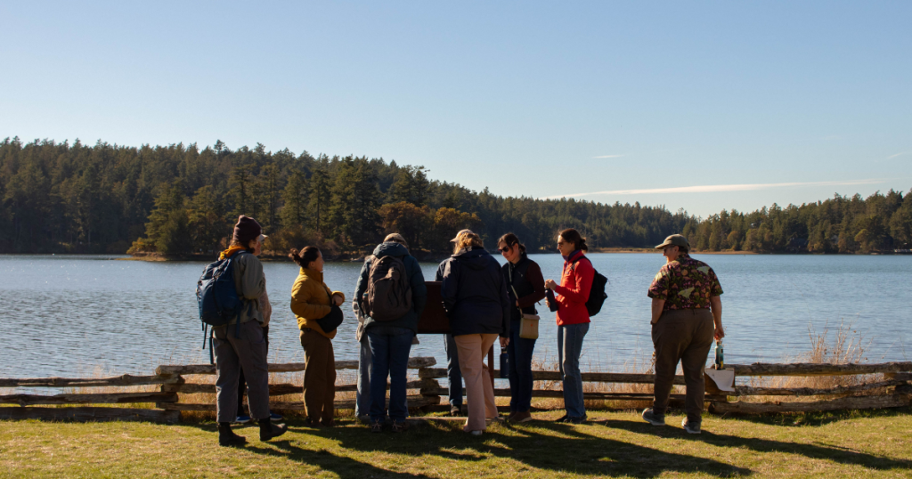 Several WSG staff stand together while on a field trip in the San Juan Islands