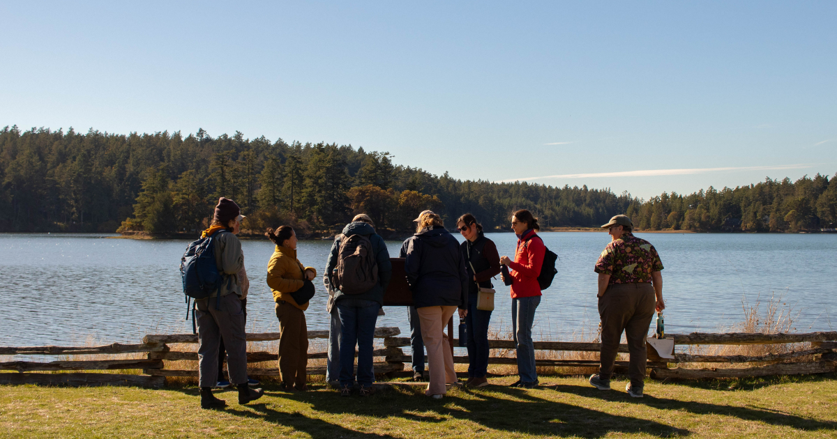 Several WSG staff stand together while on a field trip in the San Juan Islands