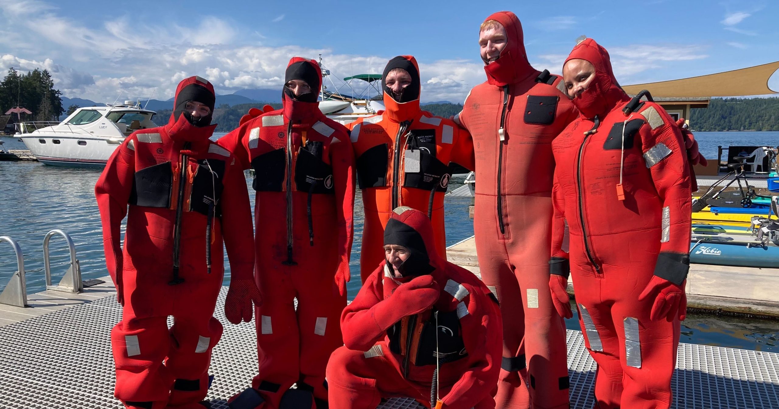 Attendees of a past WSG training wearing survival suits.