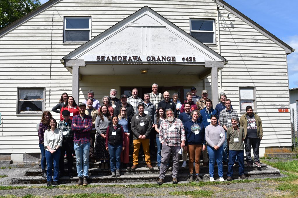 Participants in the Wahkiakum Common Ground workshops stand for a photo