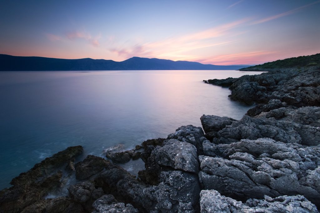 Rocky Puget Sound shoreline at sunset