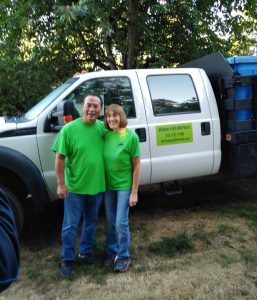 Gene and Jania in front of their truck
