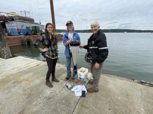 Michelle Lepori-Bui with two SoundToxins volunteers, smiling at the camera.