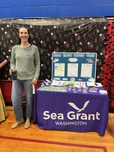 Jenna Keeton, WSG fisheries specialist, with an WSG outreach table
